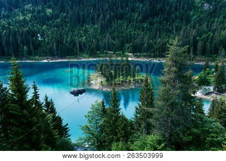 Caumasee Lake With A Small Island Located In The Middle Of The Crystal Clean Lake, Near Flims, Switz