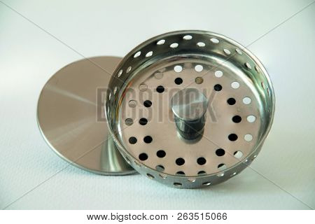 Metallic And Shiny Stopper Of A Sink For Being New.