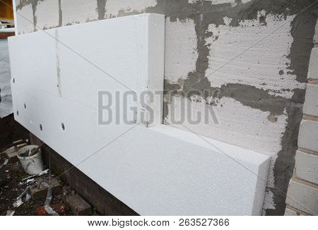 Rigid Extruded Polystyrene House Wall Insulation. Insulating House Aerated Concrete Blocks Wall With