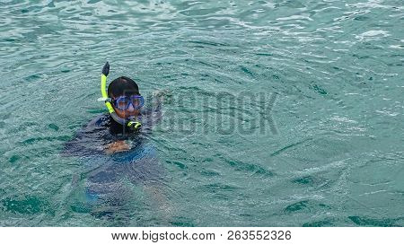 Labuan,malaysia-sept 22,2018:man Enjoying Snorkeling In Tropical Lagoon Of Rusukan Kecil Island At L