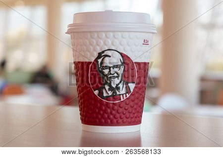 Moscow, Russia, October 11, 2018 : Coffee in paper cups with KFC logo on the table at KFC