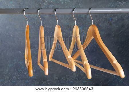 Wood Empty Hangers On Rack With Rustick Background, Copy Space