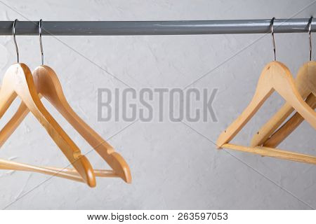 Wood Empty Hangers On Rack With Rustick Background, Copy Space