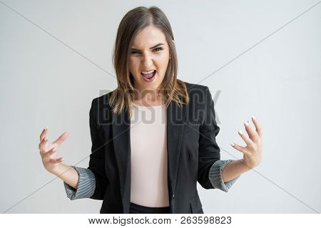 Energetic Young Caucasian Woman Raising Hands And Screaming. Ready For Fight Pretty Dark-haired Mana