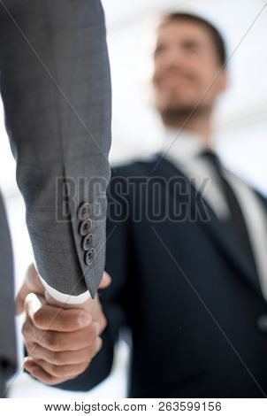close up of business handshaking from below