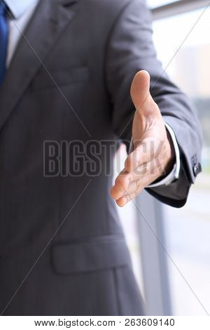 Unknown Business Man Offering Handshake While Standing Straight. Success Cooperation And Agreement C