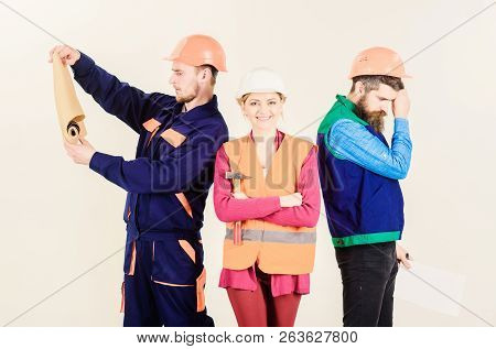 Inspector Disappointed About Employee, Builder. Men And Woman In Helmets