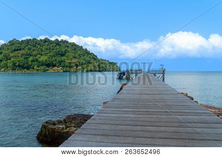 Wooden Bridge Over To Sea And Blue Sky On Tropical Beach On Koh Kood Island Trad In Thailand