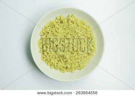 Cooked Quinoa In White Ceramic Bowl On White Background