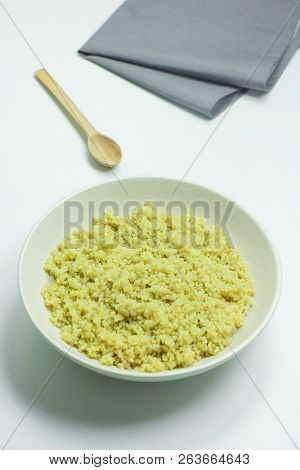 Cooked Quinoa In White Ceramic Bowl On White Background
