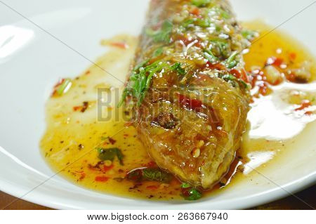 Crispy Fried Sharp Tooth Snapper Dressing With Sweet Chili Sauce On Plate