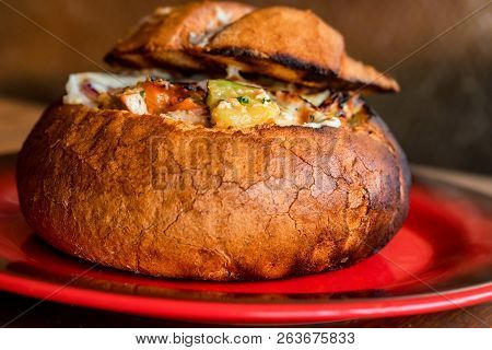 Meat Stew Served In Bread Bowl On Plate