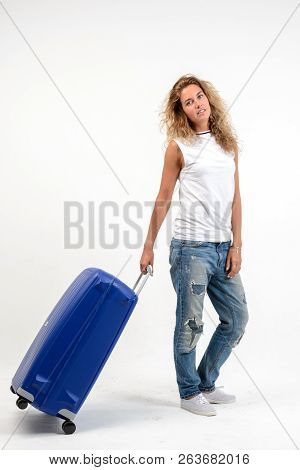 Beautiful Young Blonde Woman With Blue Plastic Suitcase On White Background