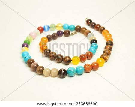 Jewelry Piece Multi-clored Beads On White Background. 
.
