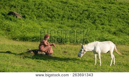 Artvin, Turkey - July 2018: An Unidentified Woman Walks With Her Horse In Gorgit Highland In Blackse