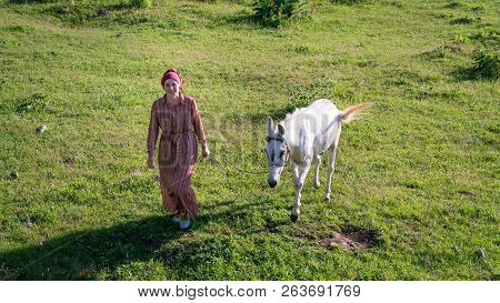 Artvin, Turkey - July 2018: An Unidentified Woman Walks With Her Horse In Gorgit Highland In Blackse
