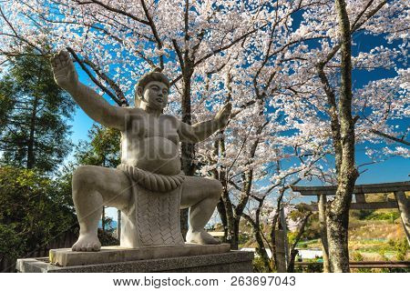 Historical Japanese Sumo shrine statue located in the Yamanobe no Michi trail in the Kansai province, Japan