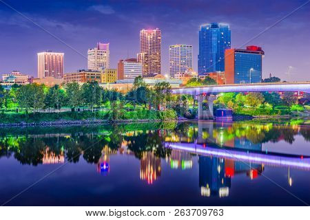 Little Rock, Arkansas, USA skyline on the Arkansas River at dusk. 
