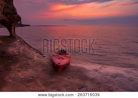 Kayak And Sunset On Lake Superior Shoreline In Norhtern Michigan, Usa
