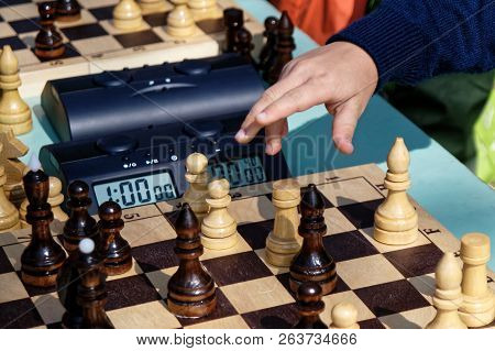 The Child Is Going To Make A Move In A Chess Game. The Game Of Intelligence