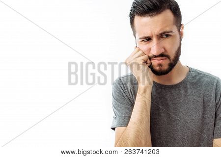 Sad Bearded Young Man Standing And Having Toothache On White Background