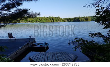 Cottage Dock On Northern Lake In North America/canada.