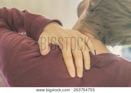 Close Up Young Man Touch Neck And Back Suffer From Strong Neckache