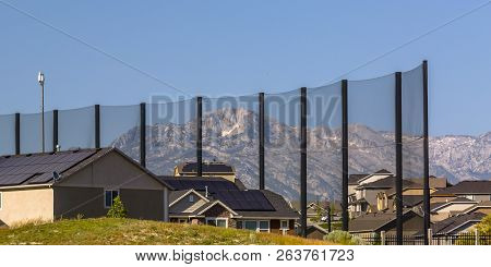Homes Beside A Golf Course Fence In Eagle Mountain