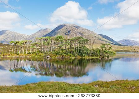 A Mountainous Landscape Reflected In Derryclare Lough, In The Inagh Valley, County Galway, Ireland.