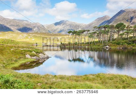 A Mountainous Landscape Reflected In Derryclare Lough, In The Inagh Valley, County Galway, Ireland.