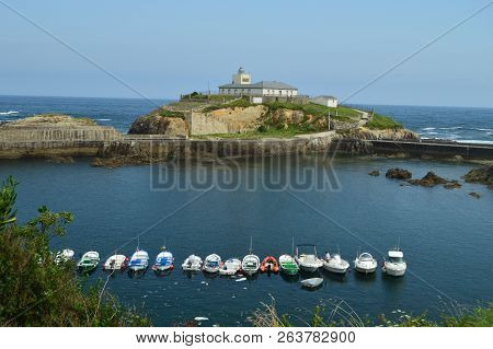 Beautiful Views Of The Fishing Port With The Lighthouse On The Background In Tapia De Casariego. Nat