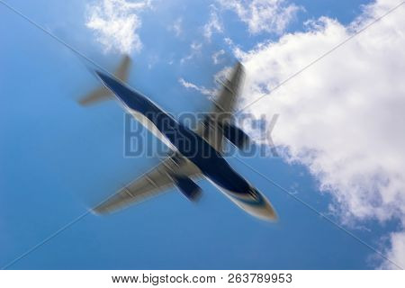 Blurred Image Of Commercial Or Cargo Plane Moving Fast Downwards. Fear Of Flying. Plane In The Sky A