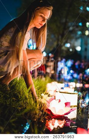 Young Womant With Chinese Lanterns Floating In Lake