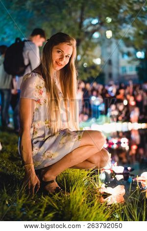 Young Womant With Chinese Lanterns Floating In Lake