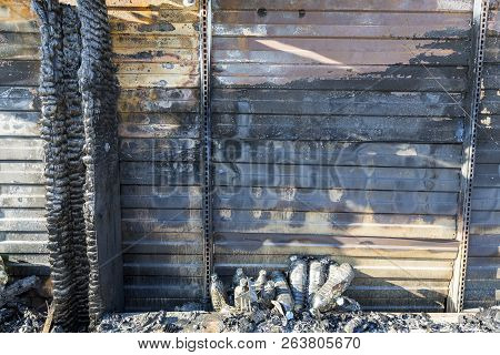 Close Up Damaged Industry Supermarket Metallic Facade After Arson Fire With Burn Debris Of Plastic B