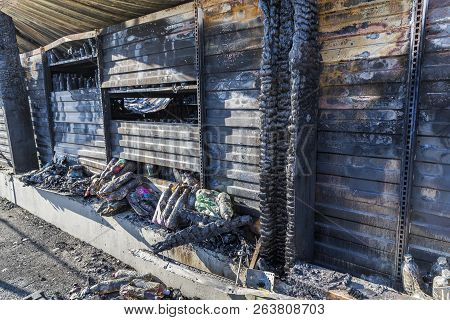 Close Up Damaged Industry Supermarket Metallic Facade After Arson Fire With Burn Debris Of Plastic B