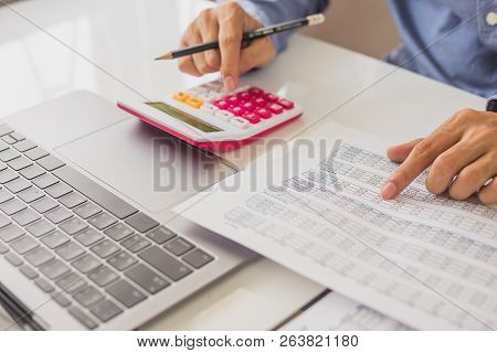 Business And Finance Investment Concept : Businessman Check About Cost And Doing Finance Graph Repor