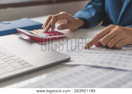 Business And Finance Investment Concept : Businessman Check About Cost And Doing Finance Graph Repor