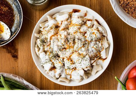 Turkish Manti Manlama / Ravioli With Yogurt And Fried Butter Sauce.
