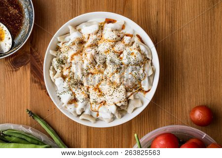 Turkish Manti Manlama / Ravioli With Yogurt And Fried Butter Sauce.