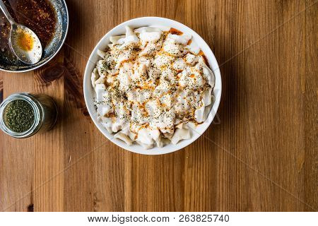 Turkish Manti Manlama / Ravioli With Yogurt And Fried Butter Sauce. Copy Space.