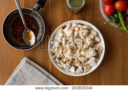 Turkish Manti Manlama / Ravioli With Yogurt And Fried Butter Sauce.