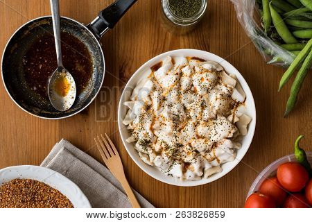Turkish Manti Manlama / Ravioli With Yogurt And Fried Butter Sauce.