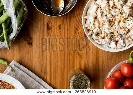 Turkish Manti Manlama / Ravioli With Yogurt And Fried Butter Sauce. Copy Space.