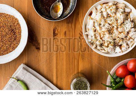 Turkish Manti Manlama / Ravioli With Yogurt And Fried Butter Sauce. Copy Space.