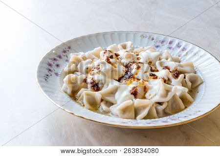 Turkish Manti Manlama / Ravioli With Yogurt And Fried Butter Sauce.