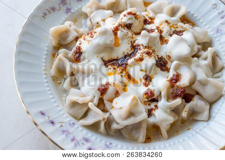 Turkish Manti Manlama / Ravioli With Yogurt And Fried Butter Sauce. Traditional Food.