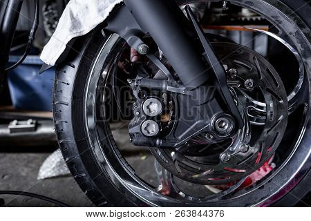 Cropped Close Up Shot Of Beautiful And Custom Made Motorcycle In The Workshop