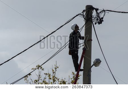 Athens, Acharnes, Stratopaido Kapota/ Greece - October 18 2018: Electrician Technician Worker Cut Ca