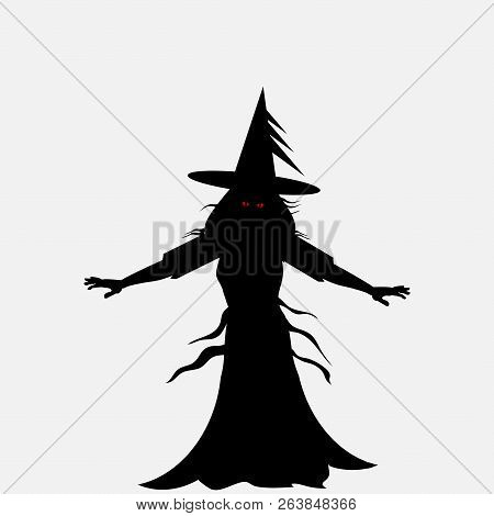 Halloween Black Silhouette Of A Scary Witch With Red Evil Eyes Over Withe Background